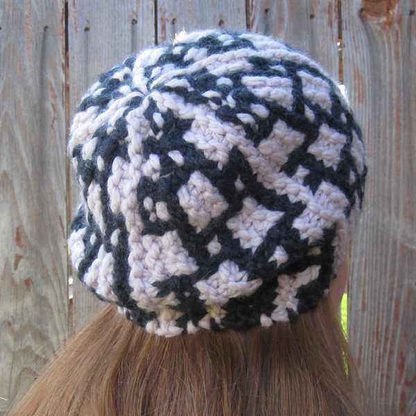 three-quarters angle back view showing the hazier stitch definition of Carreau hat in wool