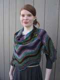 larger Rosita shawl wrapped around model's shoulders and held in place with beaded shawl pin
