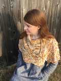 atmospheric angle of speckled Feuille-morte shawl wrapped around shoulders