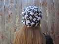 three-quarters angle back view showing the hazier stitch definition of Carreau hat in wool