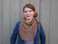 Alfarería shawlette tied like kerchief around model's neck and shoulders