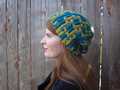 detail showing the sharper stitch definition and heavier drape of alpaca Carreau hat