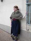 large Alfarería shawl wrapped around woman's shoulders