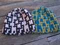 flat lay of both Carreau hats; lighter, loftier wool version on left; thicker alpaca version on right